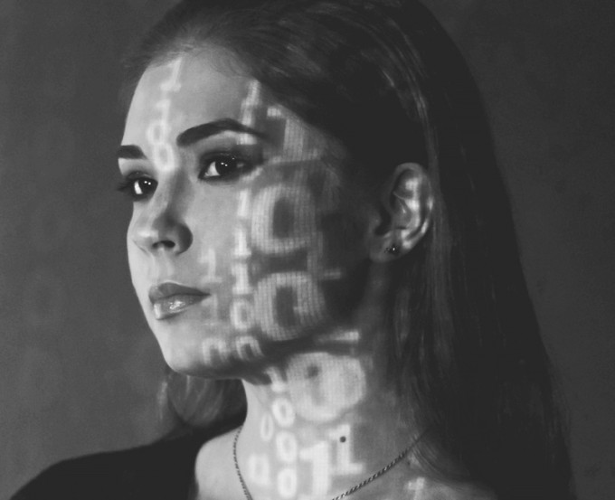 Photo of young woman with numbers on her face to depict the benefits of podcast tracking