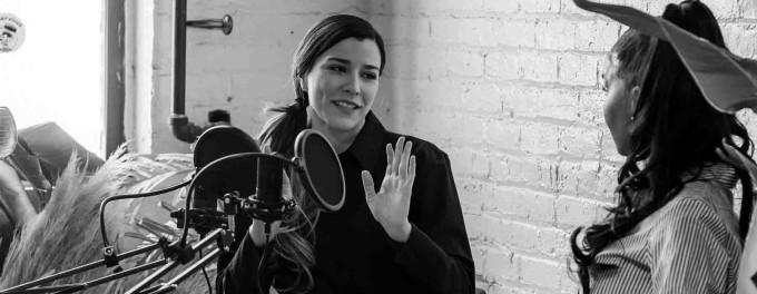 Two women enjoying a conversation on a podcast