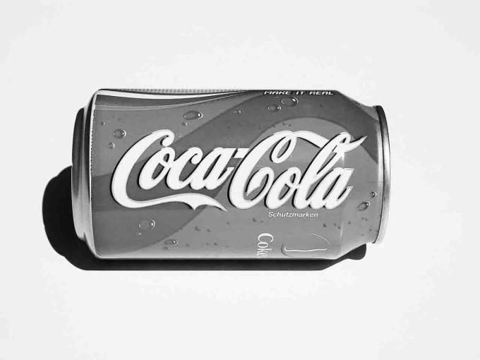 Grayscale image of Coca-cola to highlight what a branded podcast can do for a business