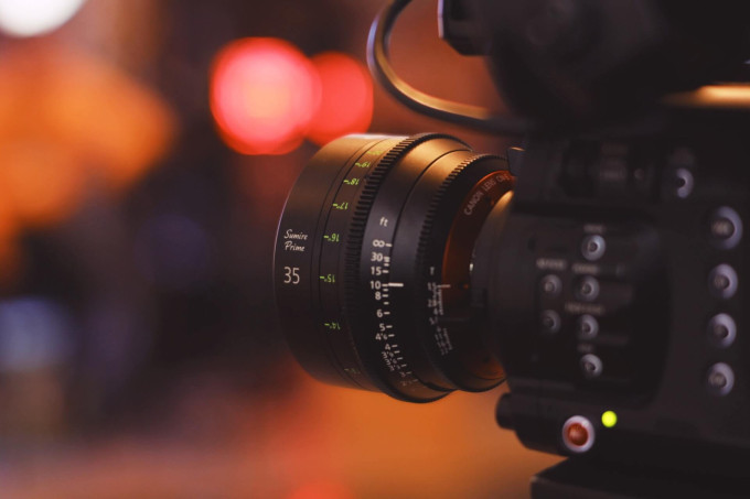 Side view of a video camera with blurred background