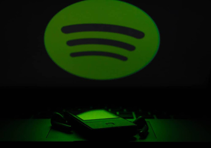 Spotify logo, smartphone and ear buds