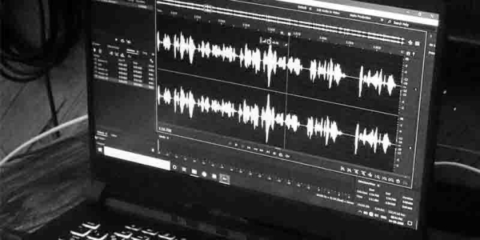 Laptop screen with audio editing software open