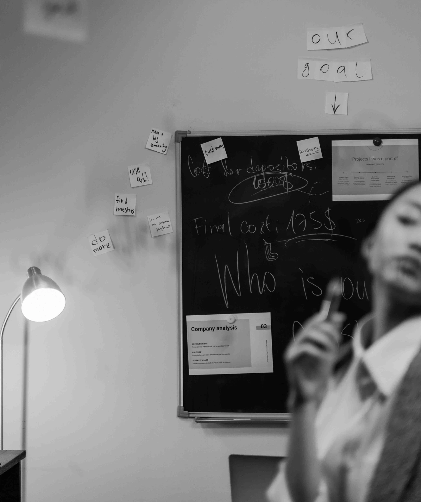 black and white image of a chalkboard with company goals, showing the idea of internal communication that could be on an internal company podcast