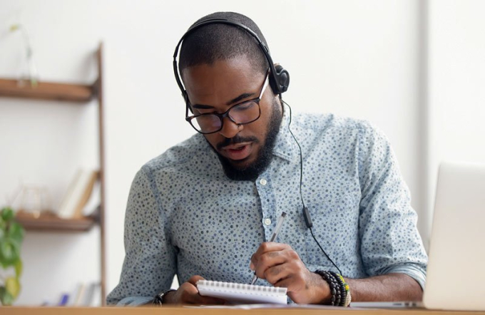 man writing a podcast script