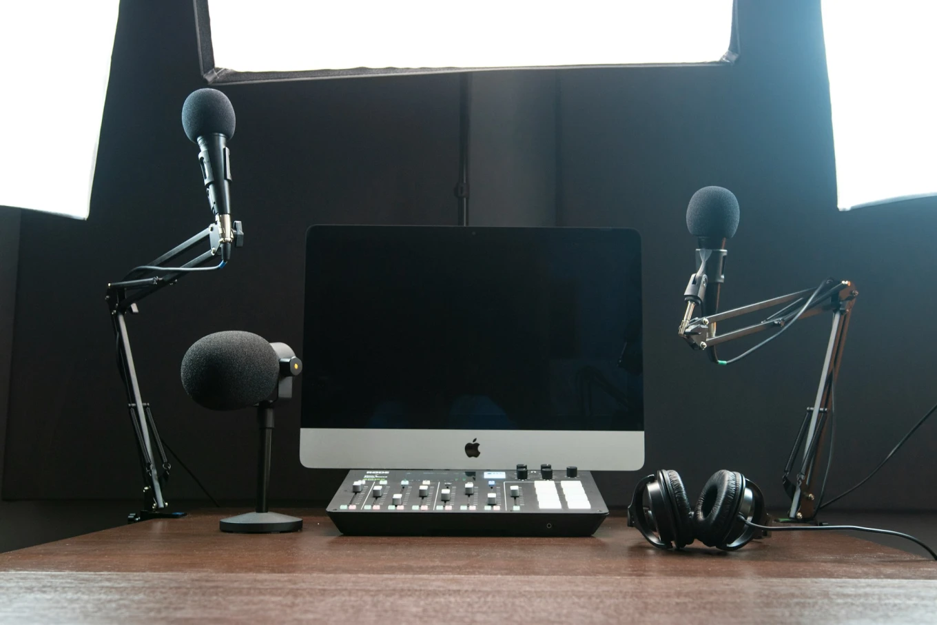 computer and microphone set up for spotify video podcast