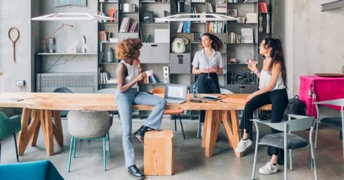 employees talking to each other in the office