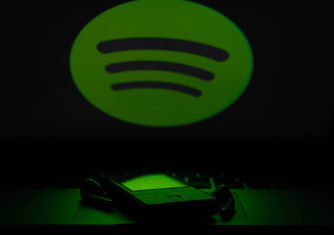 Spotify logo, smartphone and ear buds